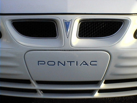 99-02 Pontiac Grand AM front bumper cover license plate filler panel trim
